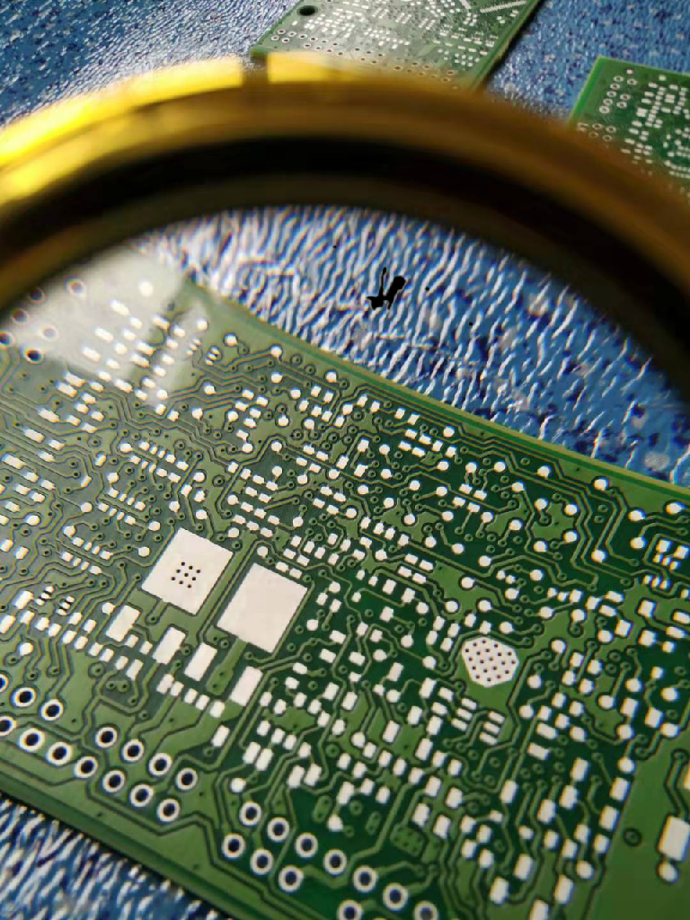 Inspection of a cleaned mixed technology PCB for residues.