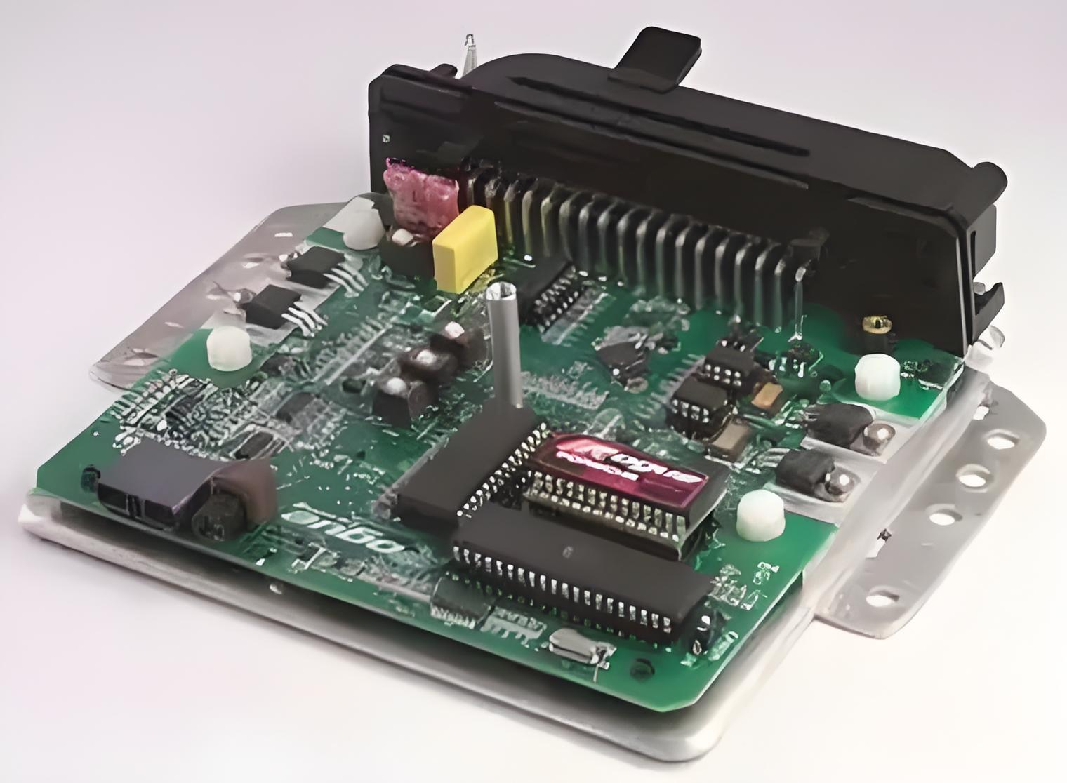 Close-up of an ECU PCB with labeled electronic components for replacement