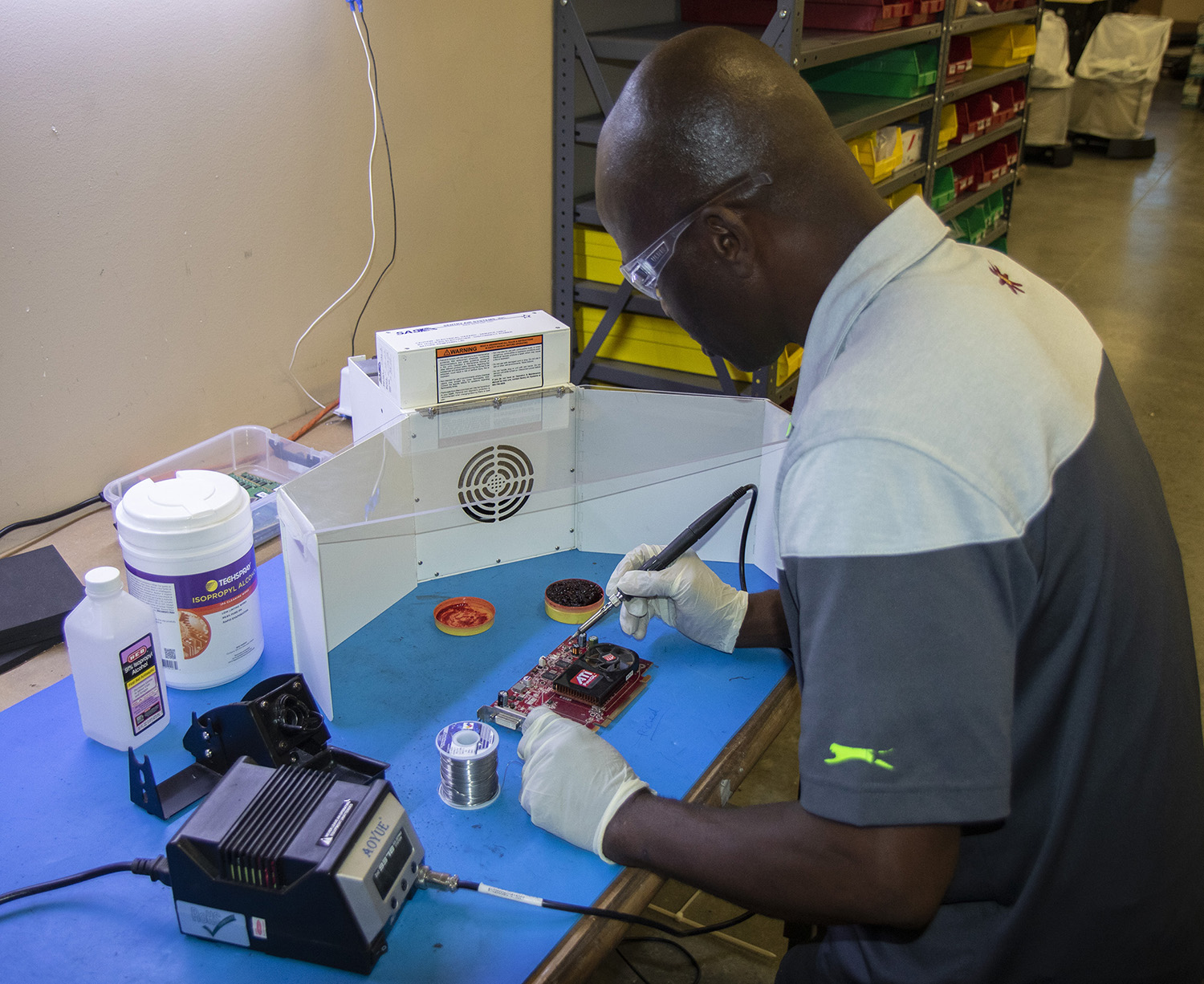 Soldering safety setup with protective gear and ventilation