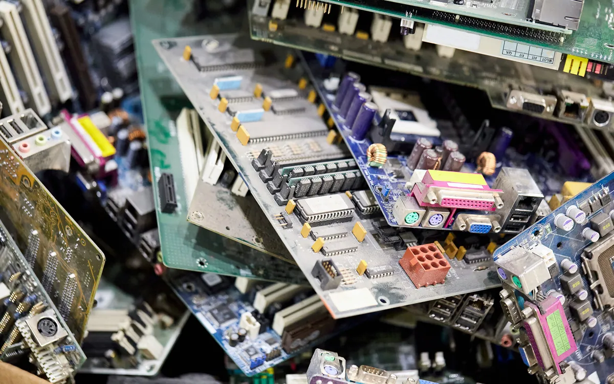 Pile of discarded PCBs highlighting the need for advanced recycling technologies
