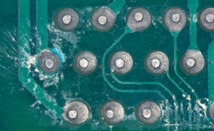 Close-up of PCB with no-clean flux residue after soldering