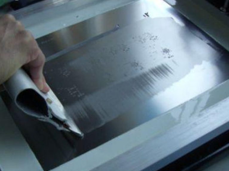 "SMT stencil design over PCB pads with vias for optimized solder paste application."