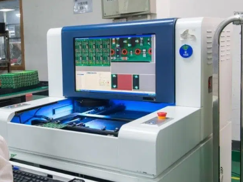 Automated Optical Inspection (AOI) machine scanning a PCB for defect detection