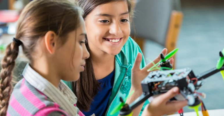 High school student designing a PCB using software for STEM education