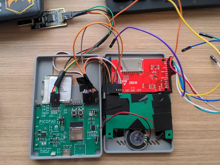 Custom PCB layout for a retro gaming console with labeled components and traces
