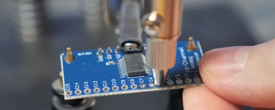 Cross-section of PCB with thermal vias for SMT component cooling.