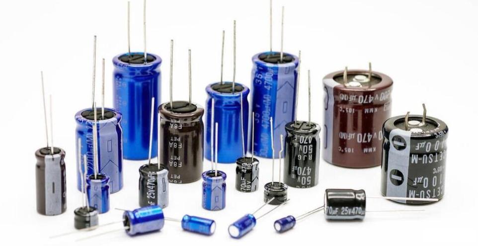 Variety of capacitors for ECU PCB capacitor selection in automotive applications.