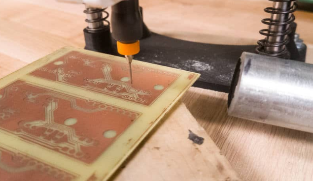 CEM-1 PCB drilling process for component holes.