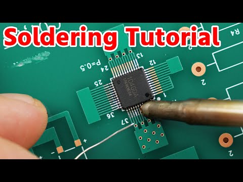 Technician soldering component on ATM PCB during repair