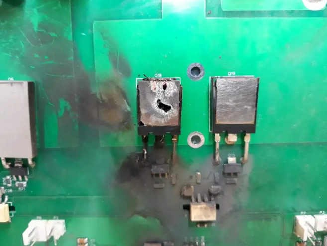 Damaged PCB with burnt components ready for repair
