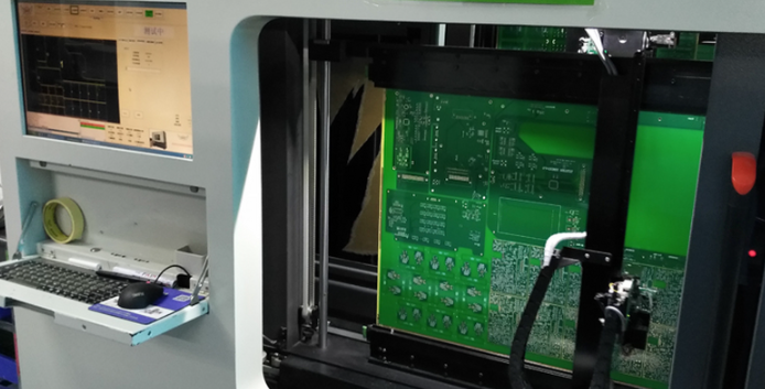 Flying probe testing machine checking electrical points on a PCB.