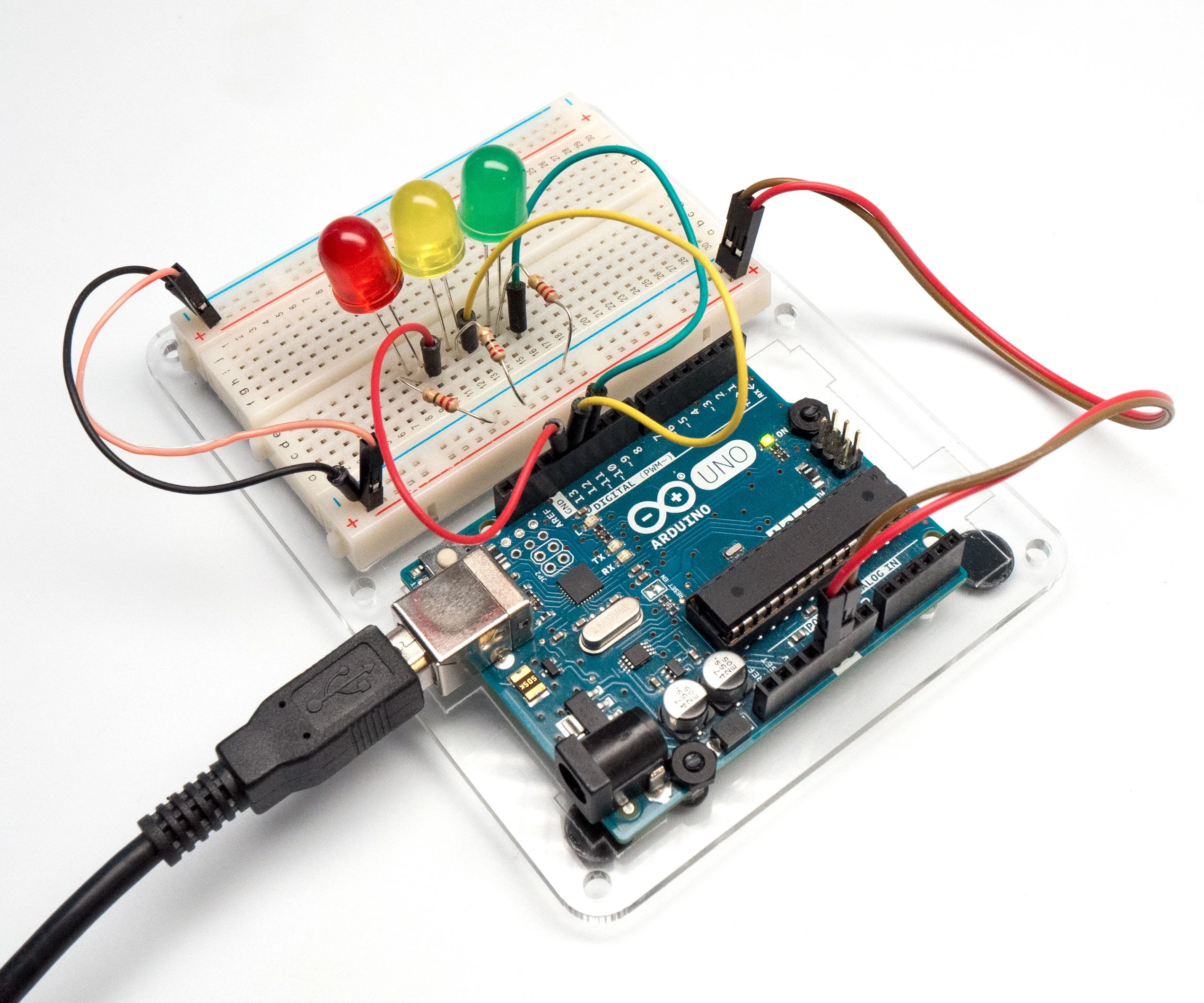 Terminal block connected to Arduino powering an LED circuit for hobby electronics.