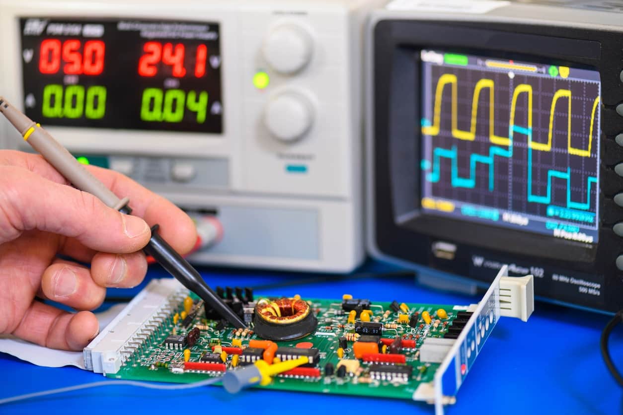Prototype testing methods using multimeter and oscilloscope on PCB.