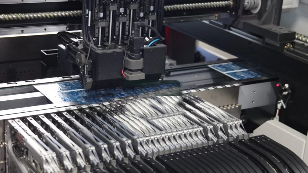 Automated pick-and-place machine during SMT process for microelectronics