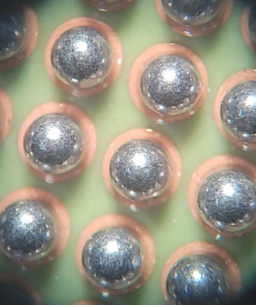 Close-up of BGA component with solder balls on PCB for rework process