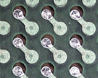 PCB with solder mask misregistration exposing copper near pads