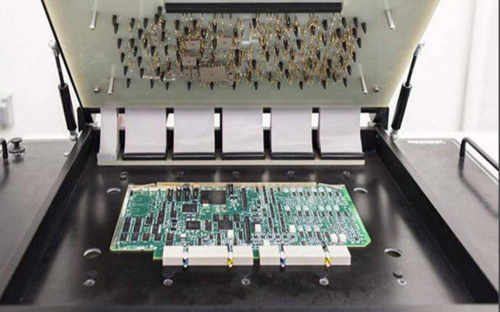Electronic component burn-in testing in a temperature chamber.