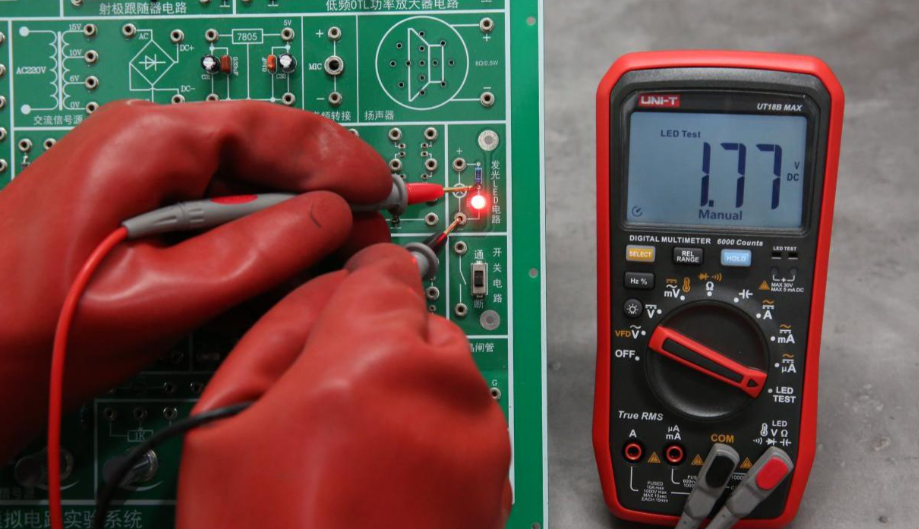 Hobbyist performing affordable PCB testing with basic tools