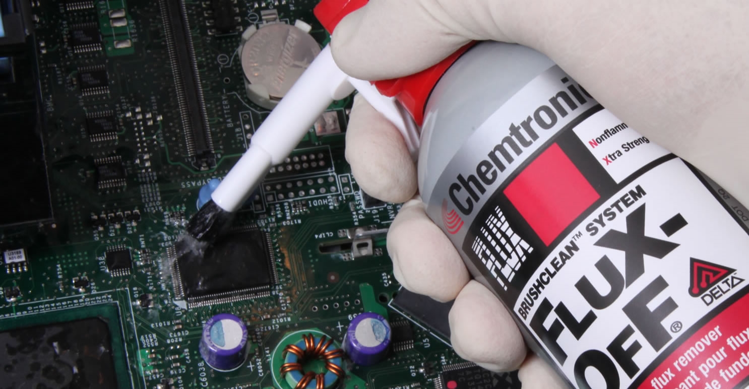 Cleaning wave solder pallets to remove flux residue.