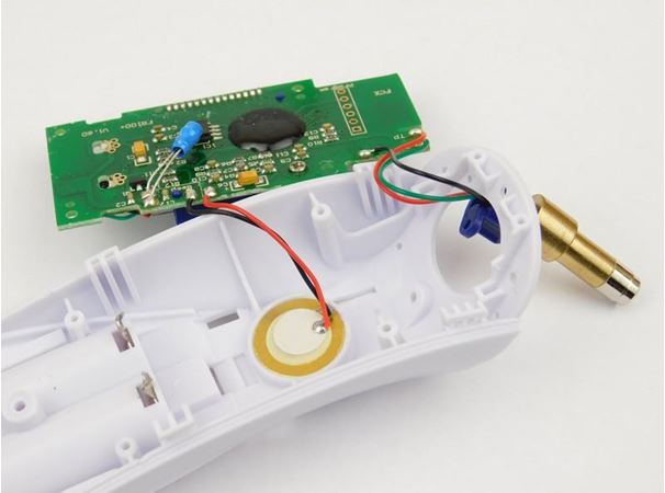 Single-sided PCB inside a consumer electronic device like a remote control.