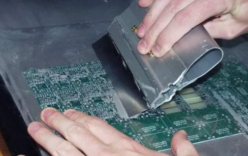 Stencil printer applying solder paste using a step-up stencil for PCB assembly