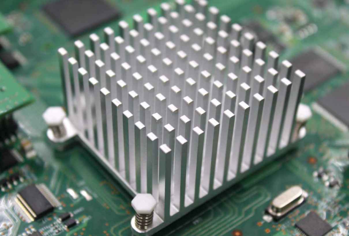 PCB with heat sink attached to a high-power component for thermal management.