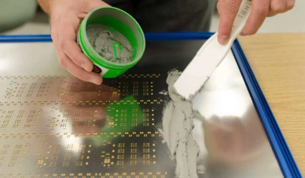 SMT stencil applying solder paste to PCB for assembly efficiency