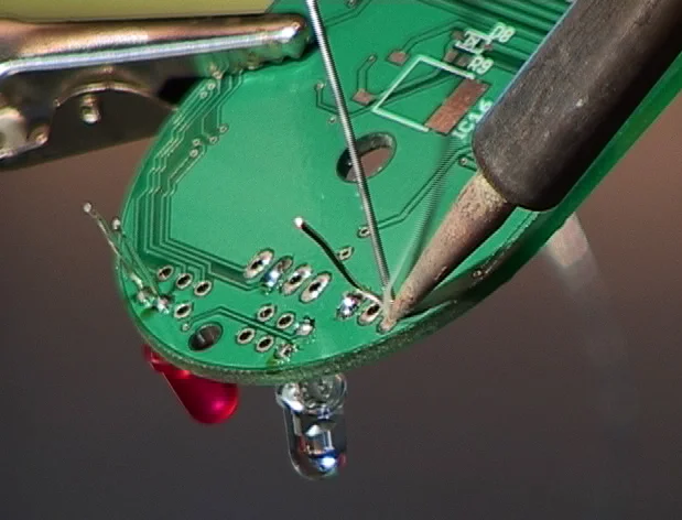 Basic soldering setup for beginners with soldering iron and PCB