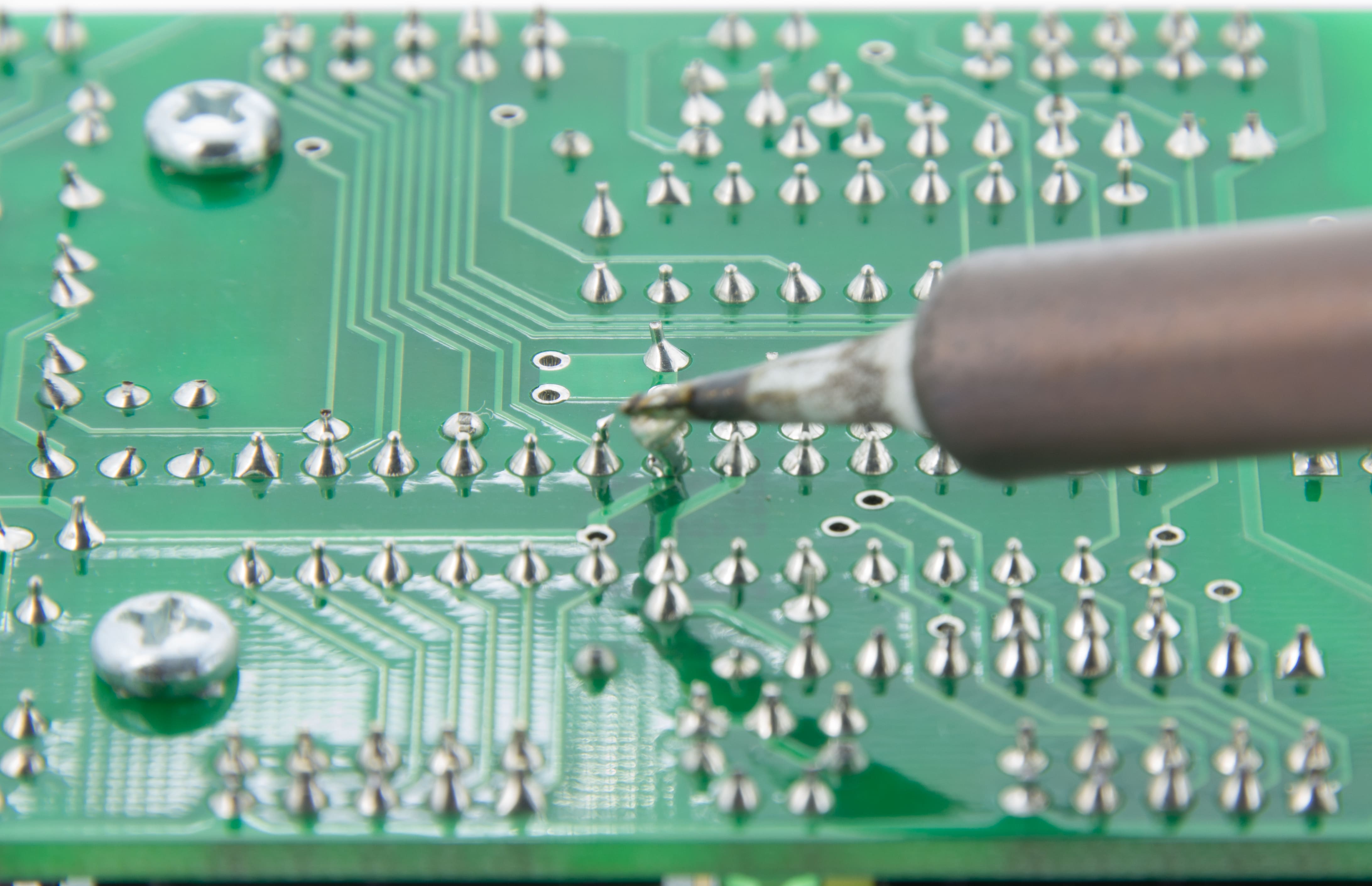 Magnified view of perfect solder joints on a completed PCB