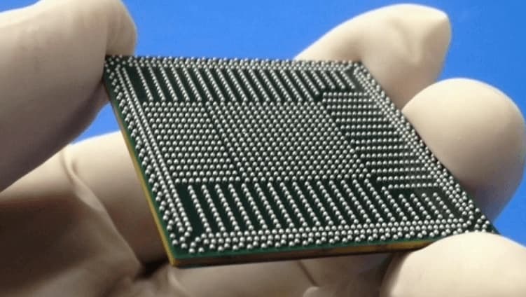 Close-up of BGA components on a PCB showing hidden solder joints