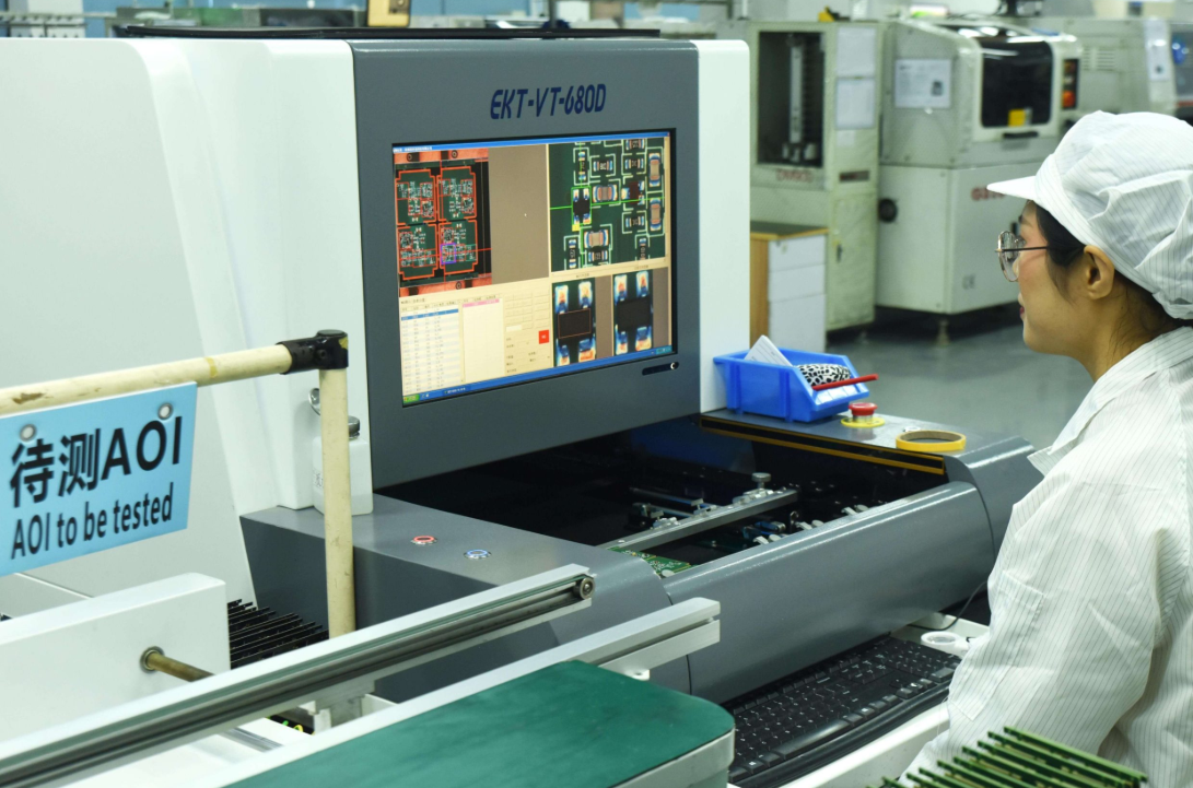 AOI machine inspecting a PCB for defects during manufacturing