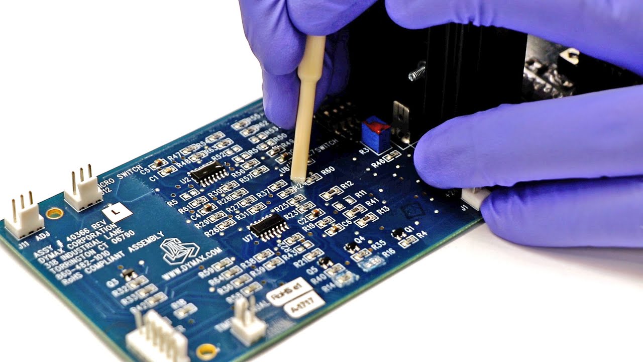 Removing conformal coating from SMT pads using solvent and brush
