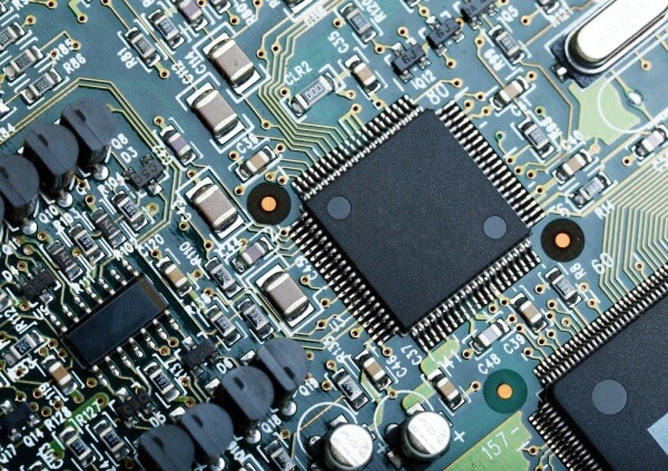 Close-up of SMT-assembled PCB with surface-mounted components.