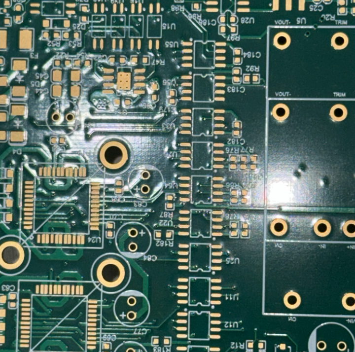 PCB showing silkscreen adhesion problems with peeling markings.