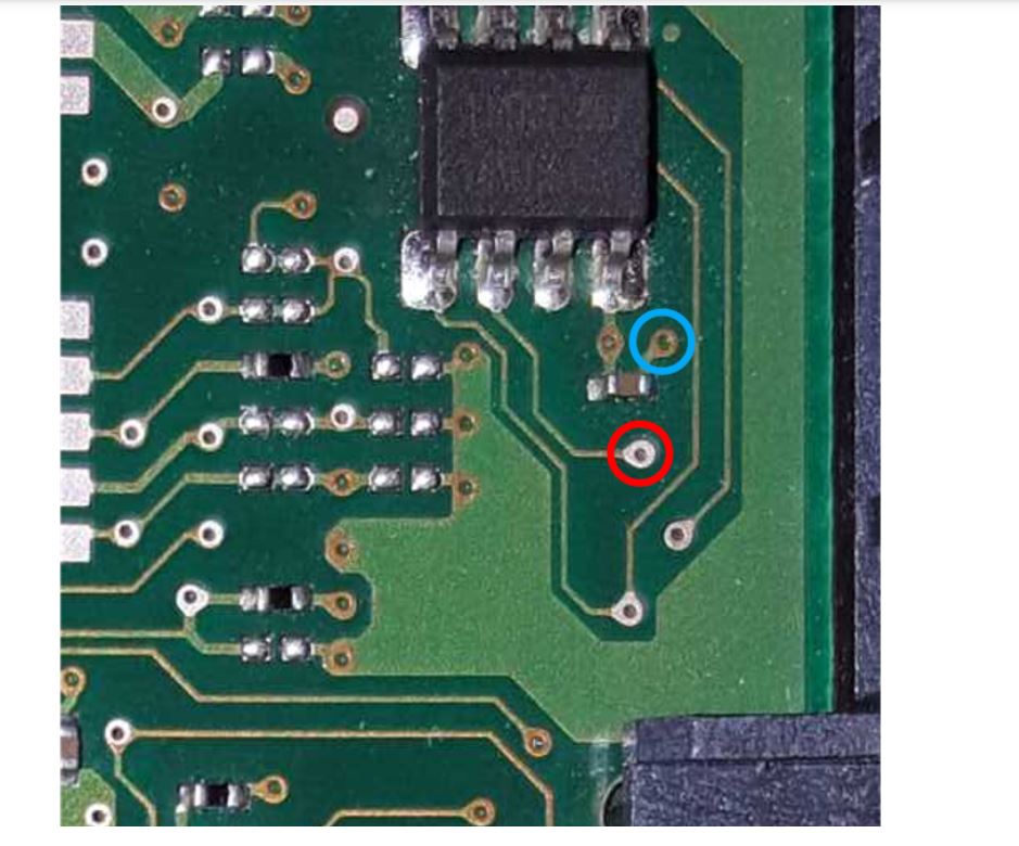 Testing PCB prototype for through-hole via integrity.