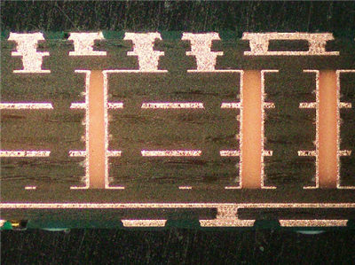 Cross-section of multilayer PCB with blind vias for signal integrity.