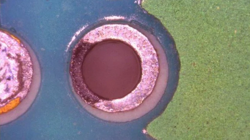 Microscopic view of black pad defect on ENIG PCB finish.