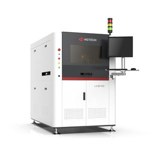 Laser drilling machine with safety barriers in PCB manufacturing.