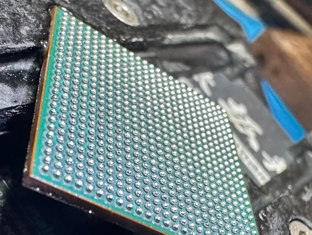 Close-up of a BGA component on a PCB showing solder balls.