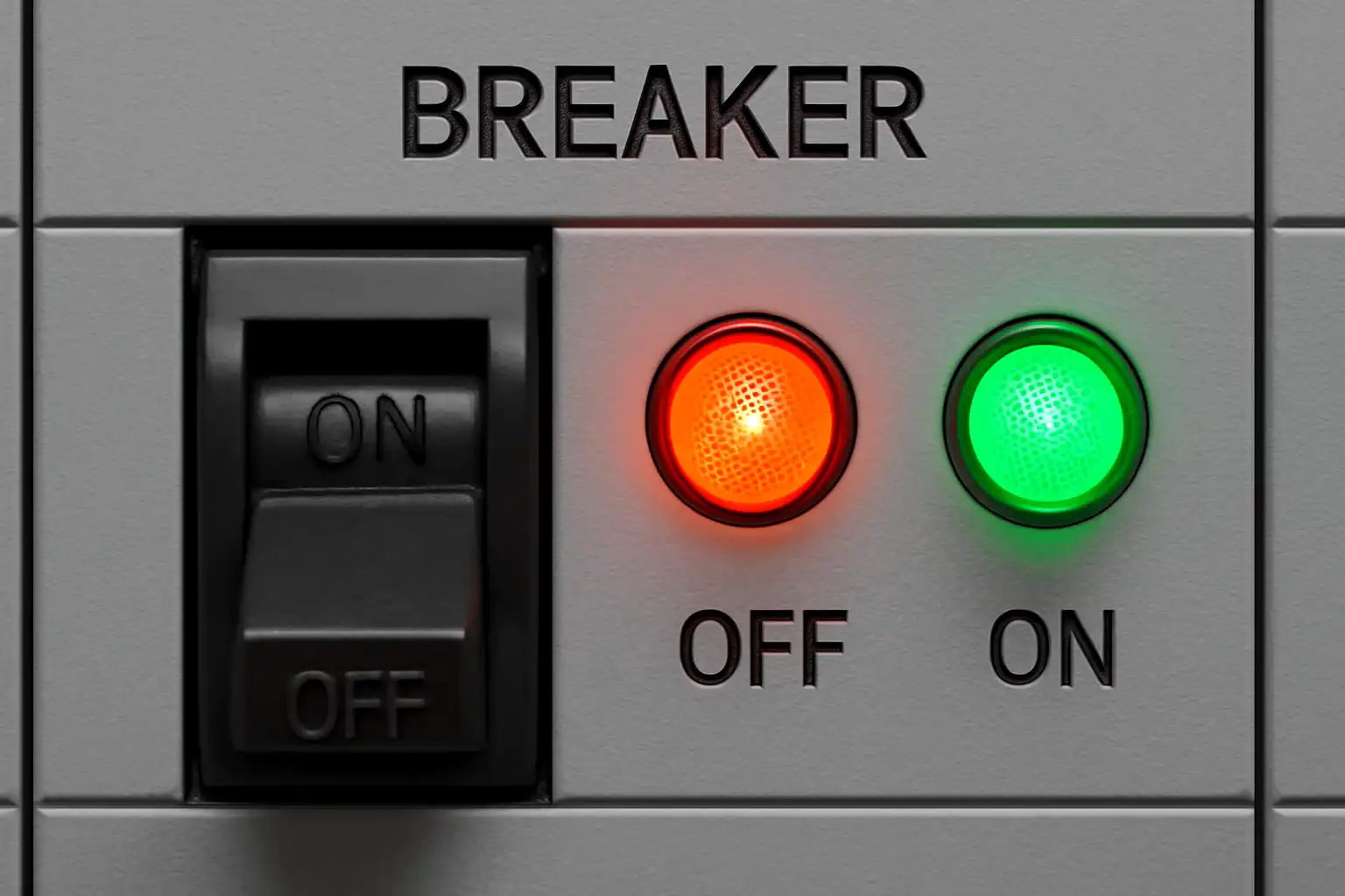 Red machine warning light on industrial control panel for safety alert