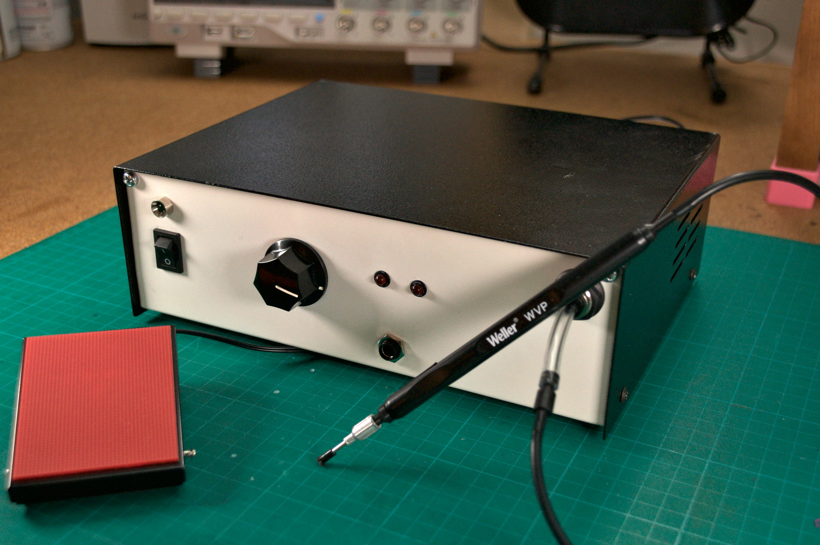 Vacuum pick tool lifting an SMD component for SMT assembly.