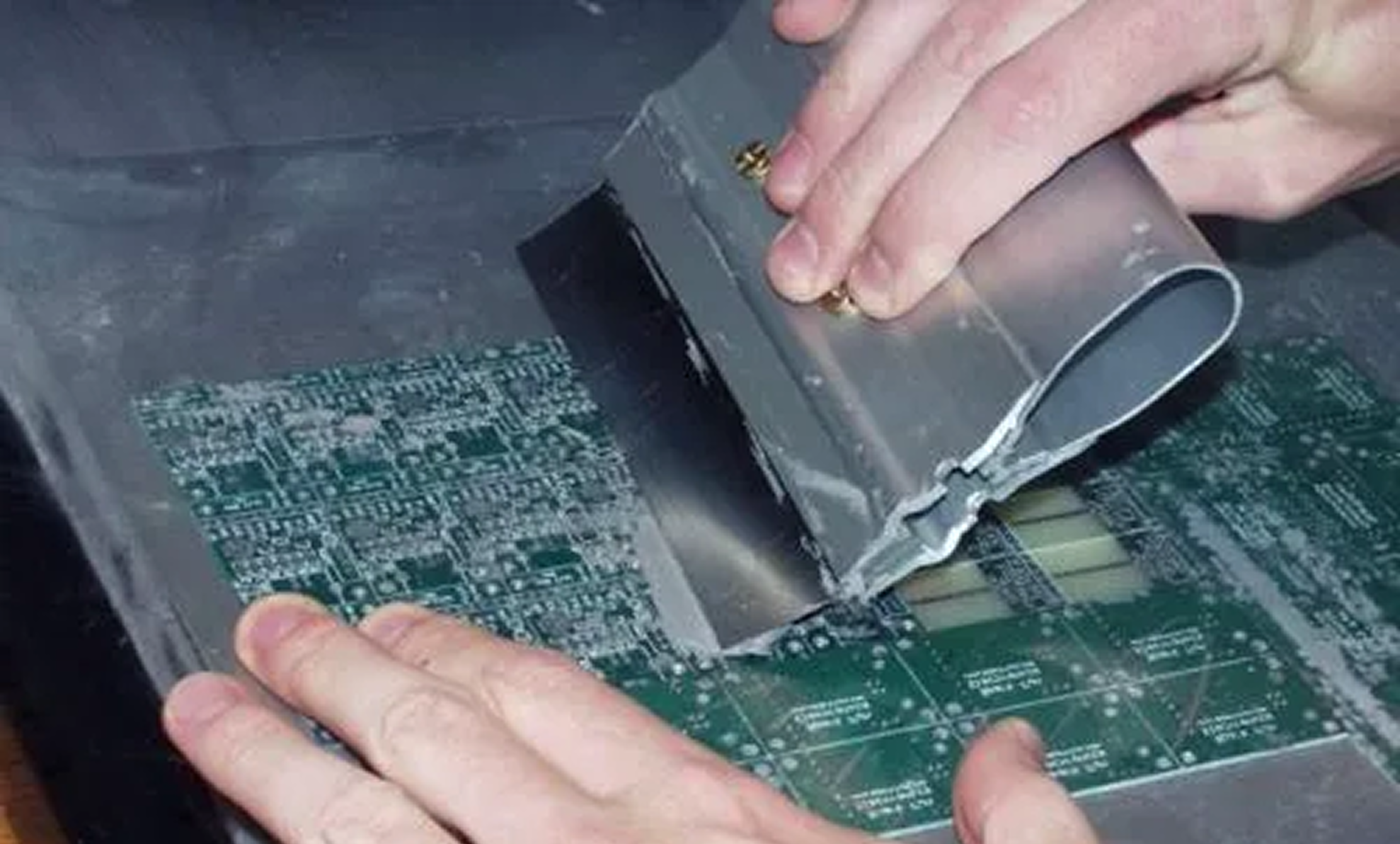 Solder paste stencil aligned on PCB for manual SMT assembly