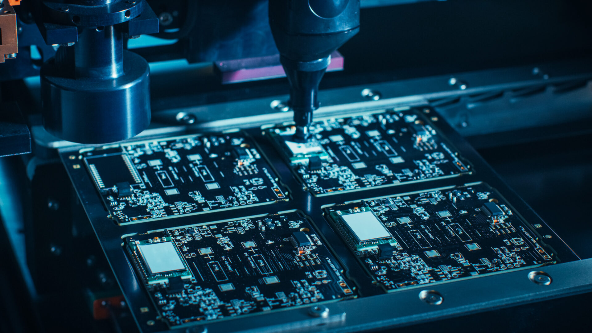 Automated pick-and-place machine aligning components on PCB for reflow soldering.