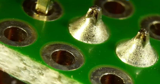 Close-up of lead-free solder joints on a sustainable PCB.