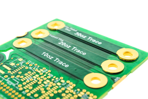 Close-up of PCB copper traces with varying thicknesses.