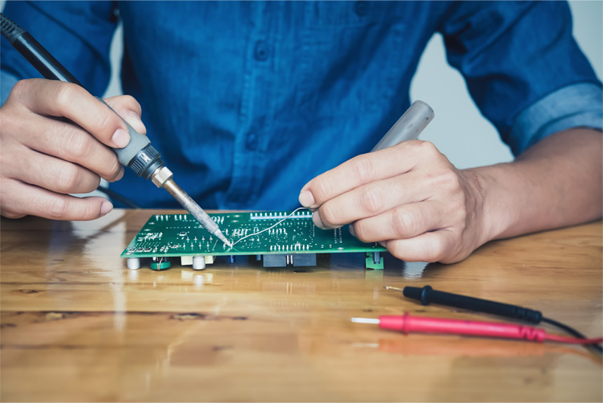 Manual soldering of double-sided PCB with soldering iron