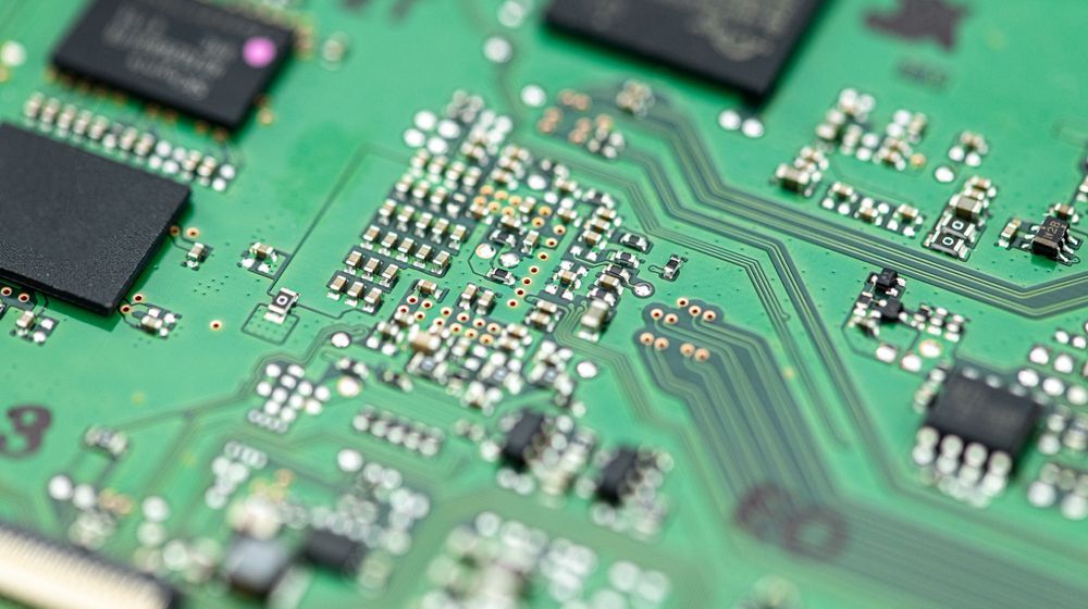 Finished PCB with copper pour and soldered components for optimal performance.