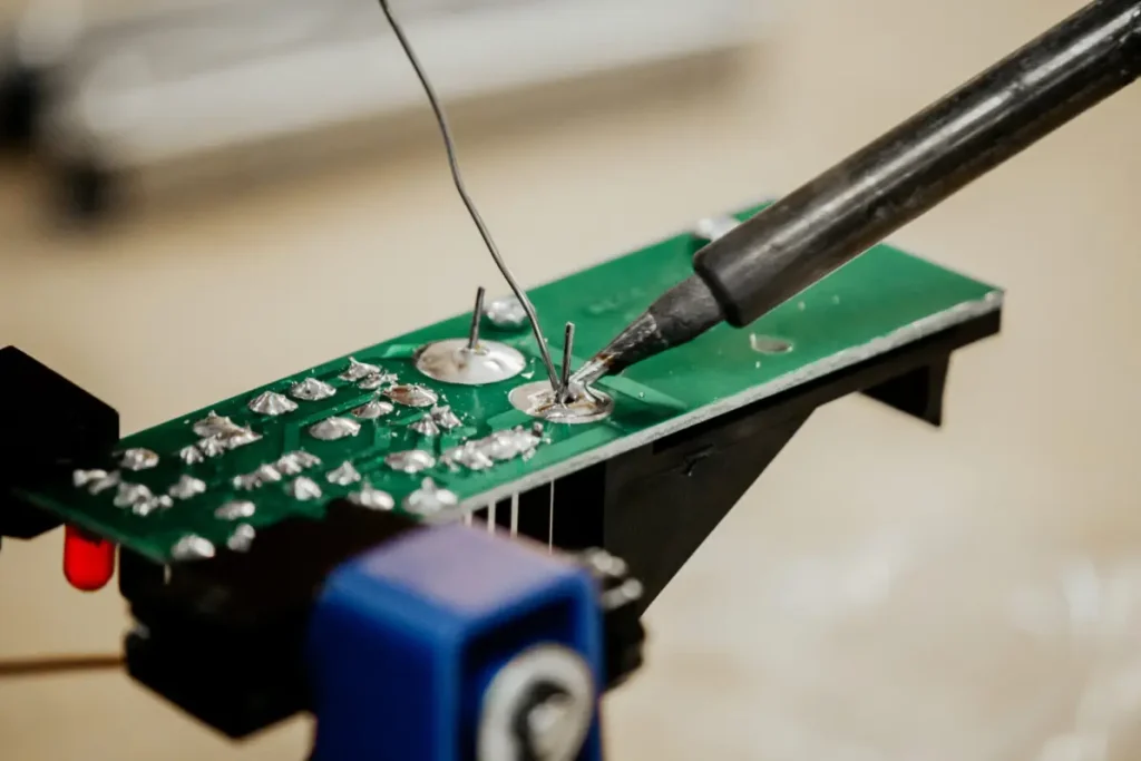 Custom long soldering iron tip for tight spaces.