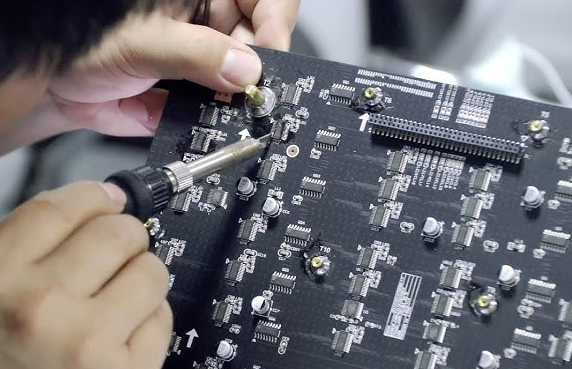 Engineer replacing degraded LED to fix brightness issues.