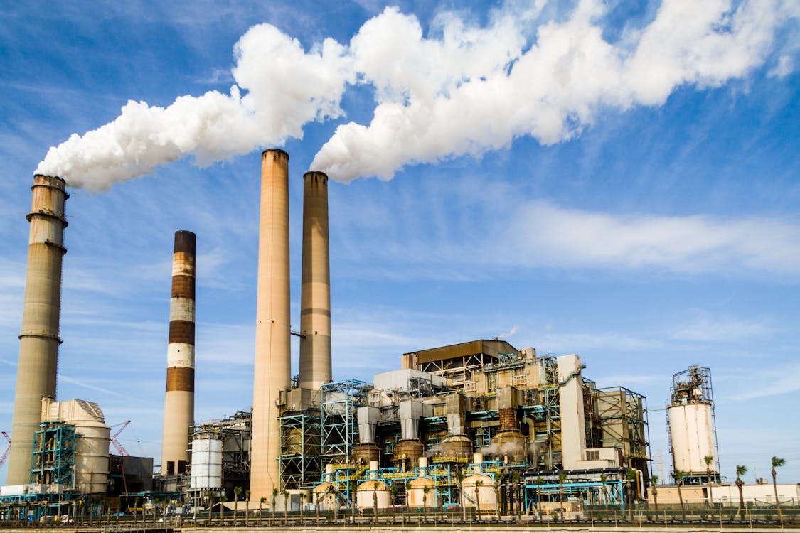 a factory with smokestacks emitting pollution